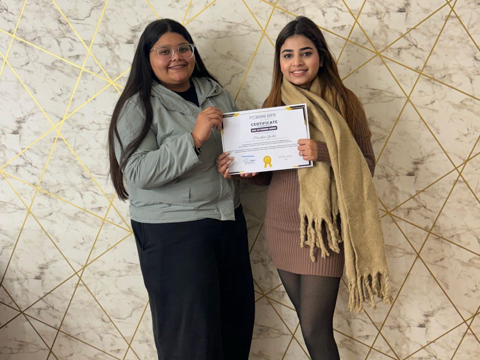 MG Makeovers Academy graduate with a certificate at the studio