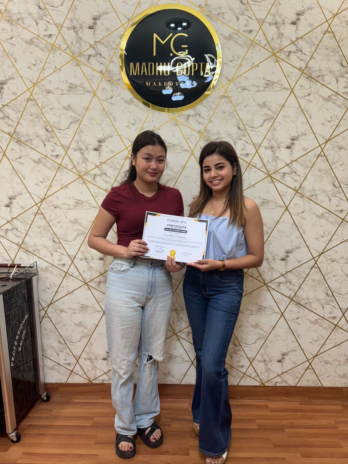 Eyelash extension course student with their MG Makeovers certificate