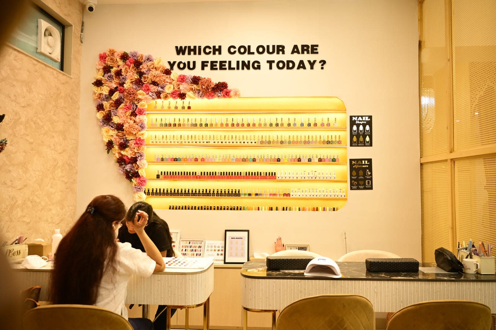 The MG Makeovers nail bar with a wall of polish colours