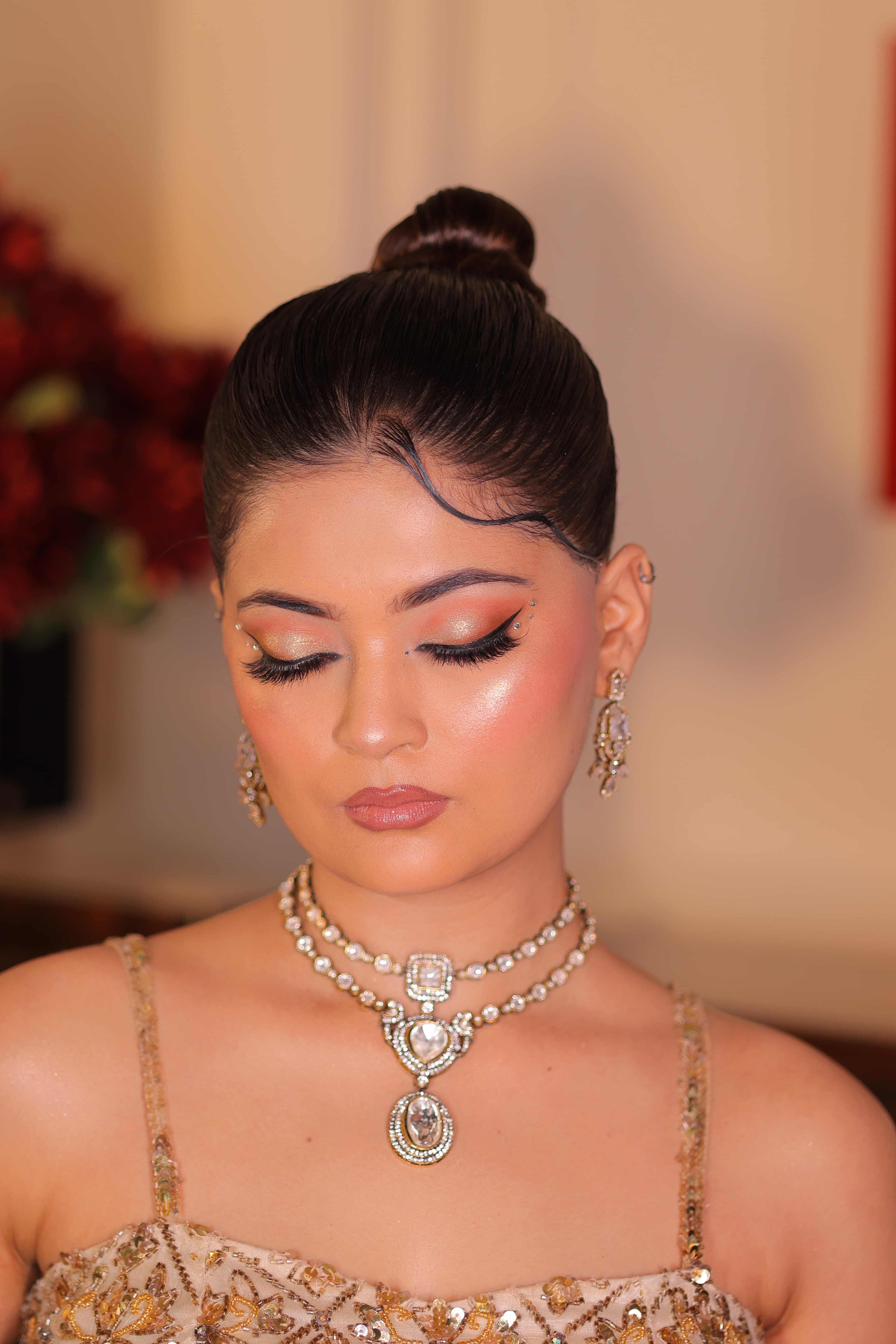 Soft glam cocktail makeup with a sleek bun and diamond necklace by MG Makeovers