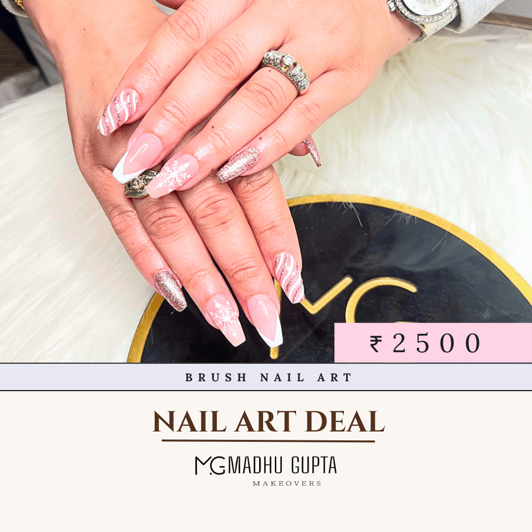 Pink glitter brush stroke nail art with snowflake detail at MG Makeovers, Gurgaon