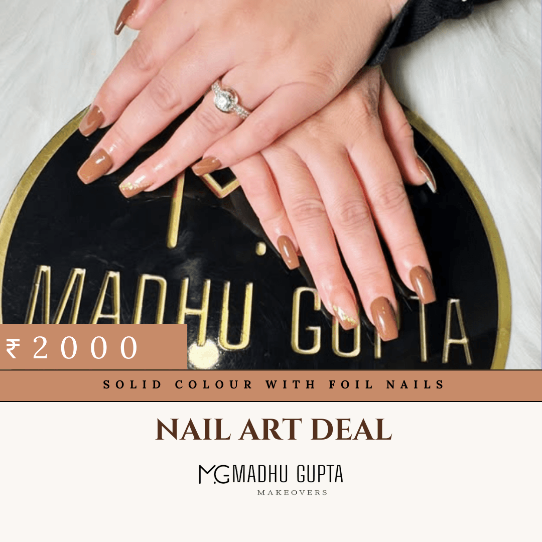Caramel brown nails with gold foil accents